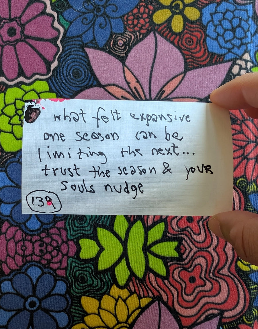 Handwritten note on a colorful floral background